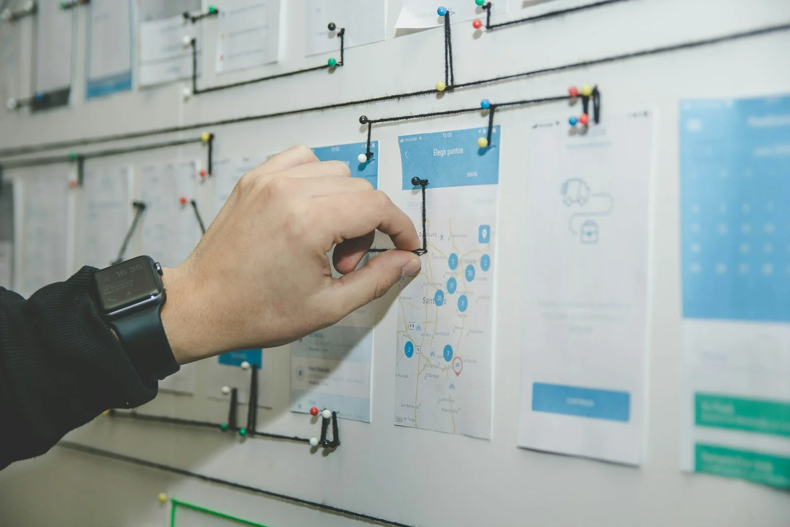 A planning wall of workflow cards being arranged during a system migration workshop